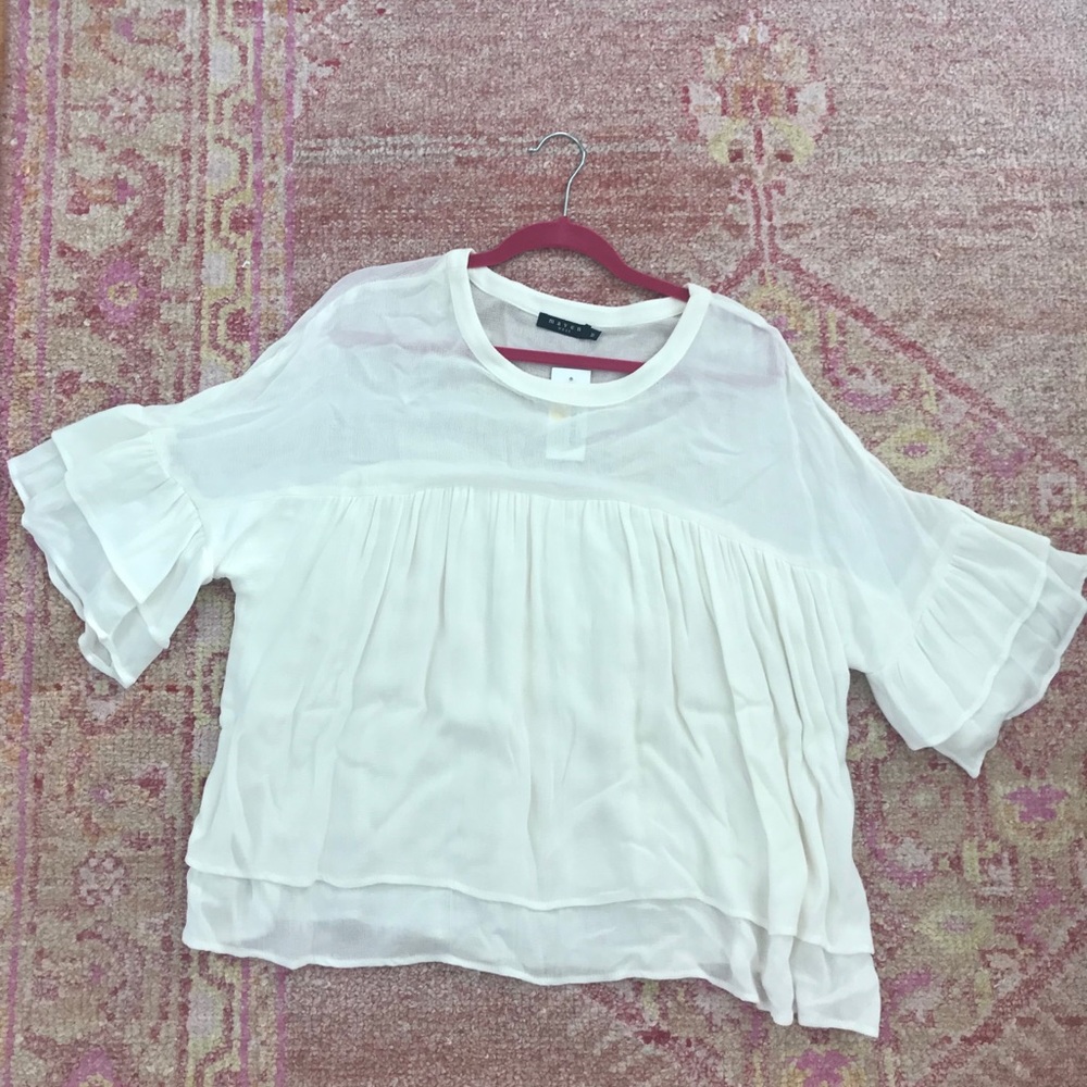 White flowy top.